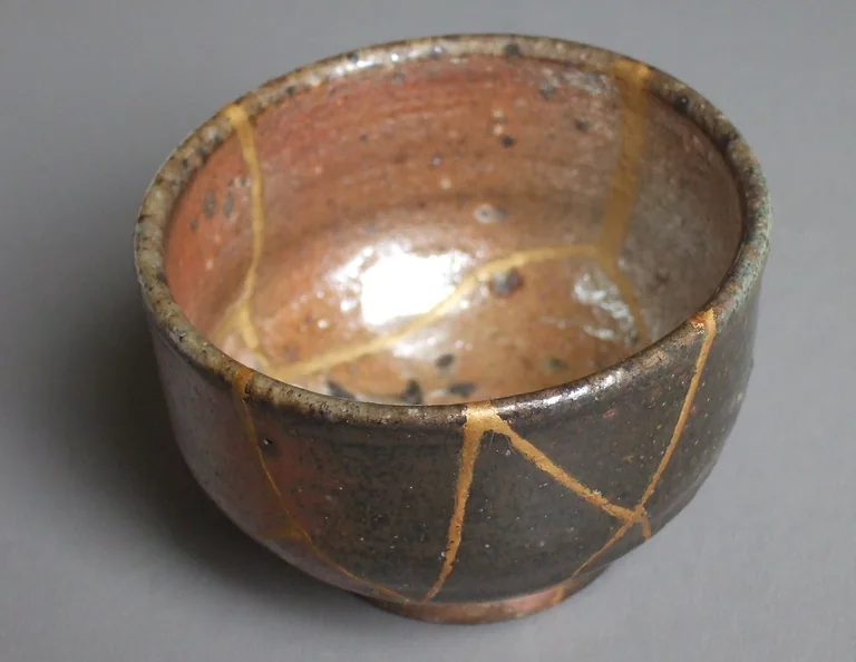 A ceramic cup repaired with kintsugi by Haragayato