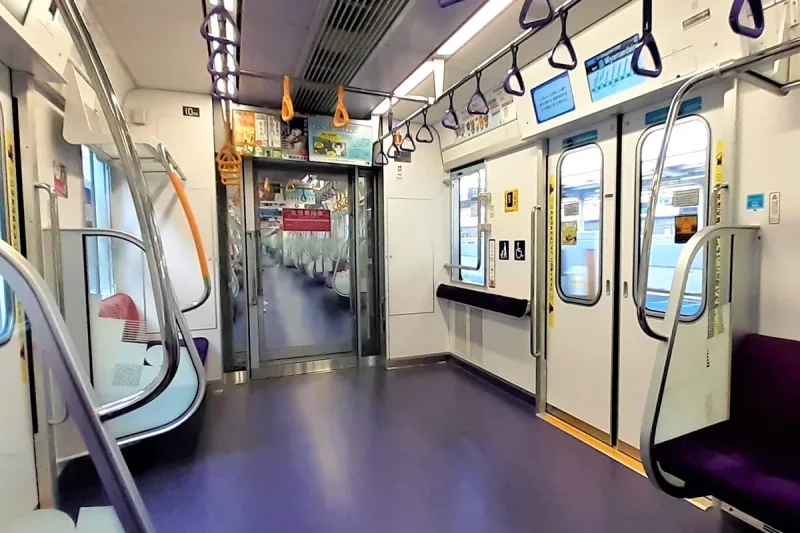 Wheelchair and stroller spaces inside a Tokyo Metro Hanzomon Line train